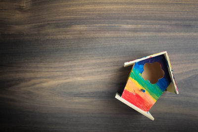 High angle view of multi colored paper on table