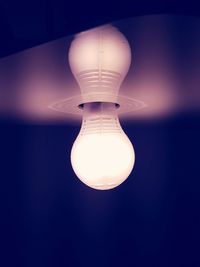 Low angle view of illuminated light bulb