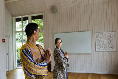 Smiling couple in yoga studio