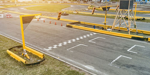 Aerial top view of the go-kart track from the drone. kart racers drive on the open track.