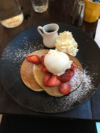 Close-up of ice cream served on table