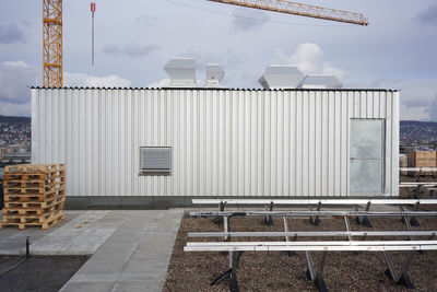 Footpath by building against sky