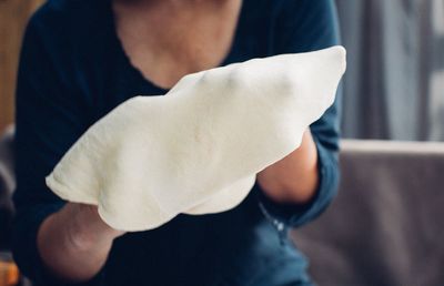Close-up of woman standing on railing