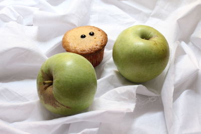 High angle view of apples on bed