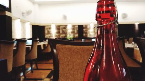 Close-up of wine bottles on table in restaurant