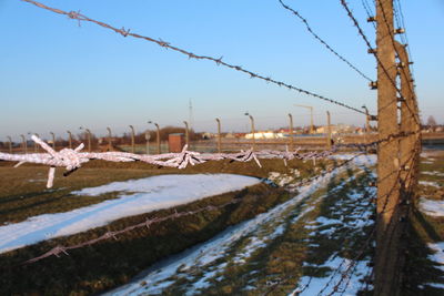 Scenic view of snow covered land against clear sky