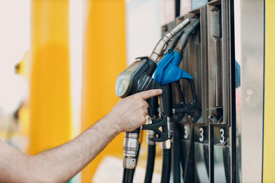 Cropped hand of man repairing car