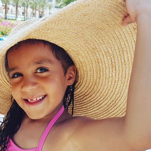 Portrait of smiling girl wearing sunhat