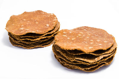 Close-up of cake against white background