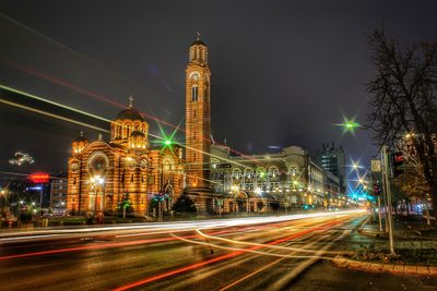 Illuminated city buildings at night