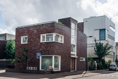 Exterior of buildings against cloudy sky