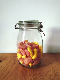 Close-up of candies in jar on table at home