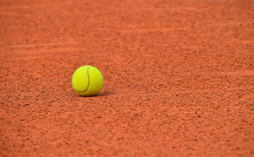 Close-up of yellow ball on field