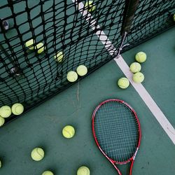 High angle view of rackets and balls at court