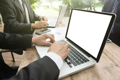 Low angle view of man working on table