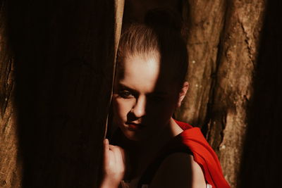 Close-up of thoughtful woman in forest