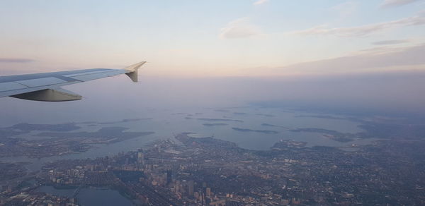 Aerial view of cityscape against sky during sunset