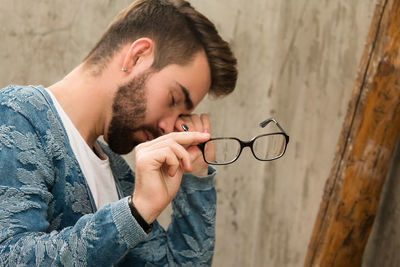 Close-up of young man using mobile phone