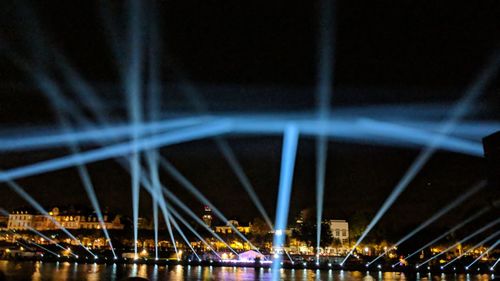 Illuminated ferris wheel at night