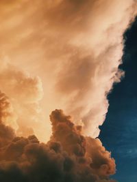 Low angle view of dramatic sky during sunset