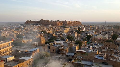 High angle view of townscape against sky during sunset