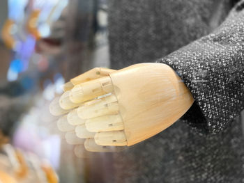 Close-up of hand holding wood