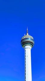Low angle view of communications tower against sky
