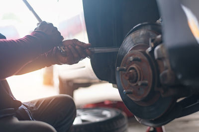 Midsection of man working in workshop