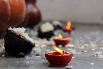 Close-up of lit diyas