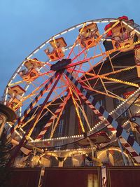 Low angle view of ferris wheel against sky