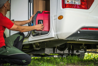 Cropped image of man working on car