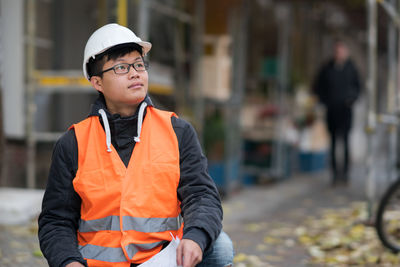 Portrait of engineer in reflective clothing outdoors