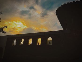 Silhouette of building at sunset