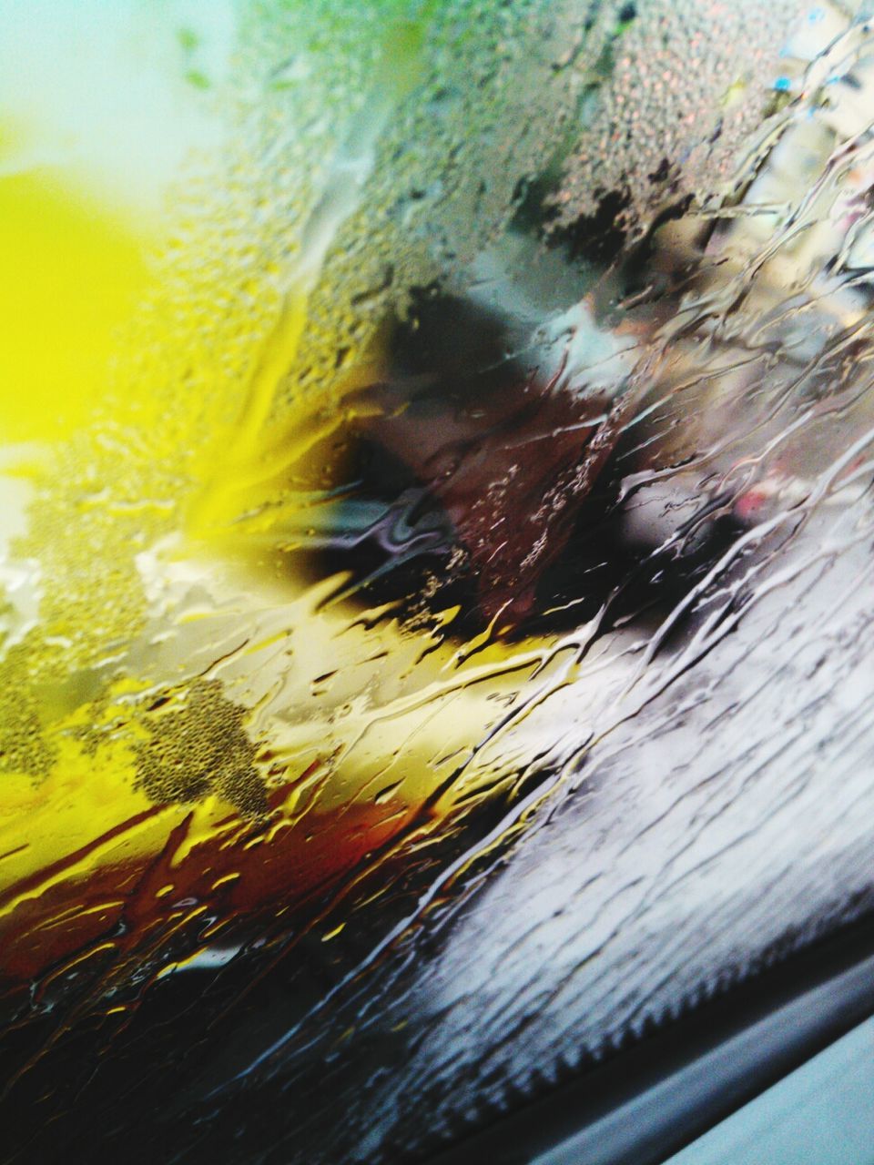 glass - material, water, wet, transparent, window, motion, close-up, transportation, drop, reflection, rain, car, blurred motion, yellow, mode of transport, indoors, land vehicle, full frame, glass, no people