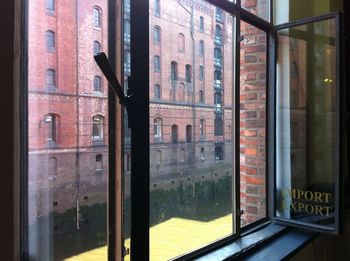 Reflection of building on glass window