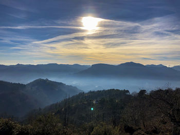 Scenic view of mountains against sky during sunset