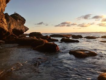 Scenic view of sea against sky during sunset