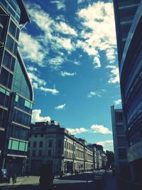 Low angle view of building against cloudy sky