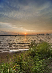 Scenic view of sea against sky during sunset