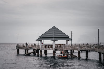 Pier over sea against sky