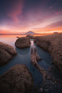 Scenic view of dau tieng lake against sky during sunset