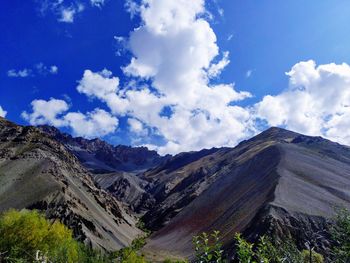 View of mountain range against cloudy sky