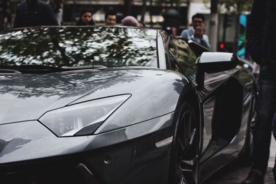 Close-up of car on road