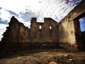 Old ruin against cloudy sky