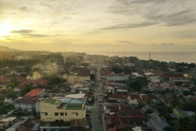 High angle view of townscape against sky at sunset