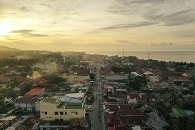 High angle view of townscape against sky at sunset