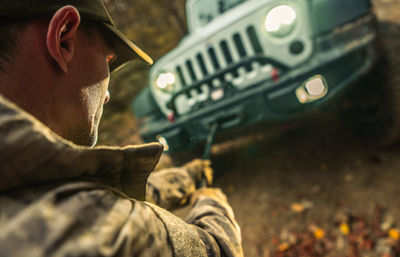 Side view of man using mobile phone