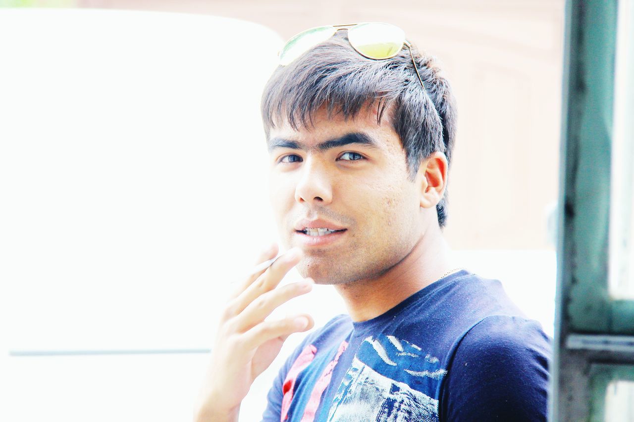 person, indoors, headshot, lifestyles, portrait, looking at camera, front view, casual clothing, young men, young adult, leisure activity, head and shoulders, handsome, close-up, focus on foreground, waist up