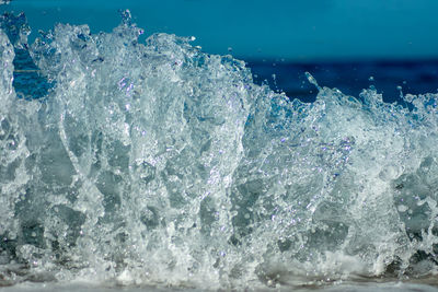 Close-up of water splashing in sea