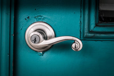 Full frame shot of blue door and handle